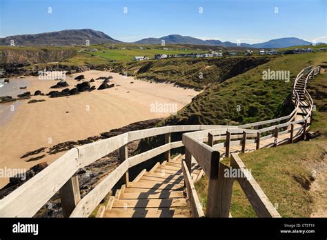Wooden Steps To Viewpoint Overlooking Sandy Beach And Blue Sea On