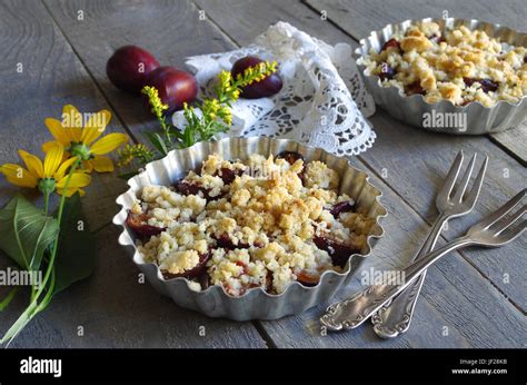 Plum Cake With Hazelnut Crumbles Stock Photo Alamy