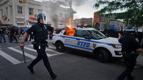 symbol of n y c unrest a burning police car the new york times