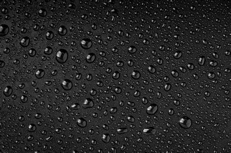 Water Droplets On Black Background Stock Photo Download Image Now