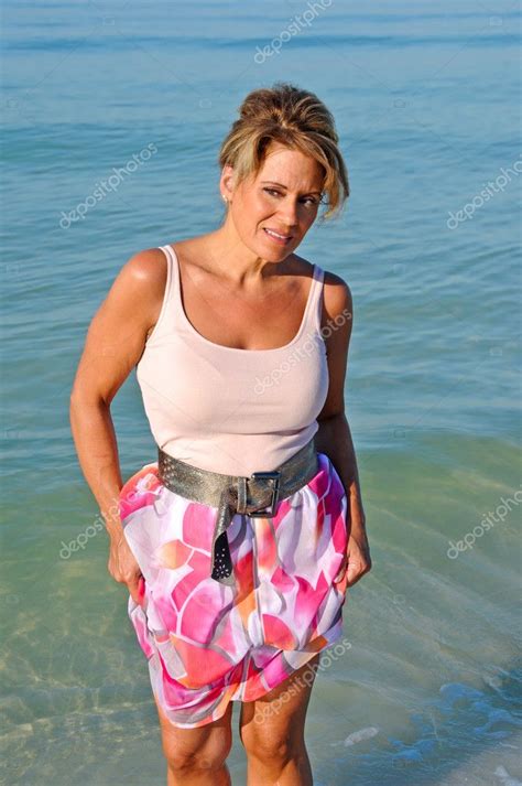 Attractive Woman Walking On The Beach Stock Photo By Eyemark