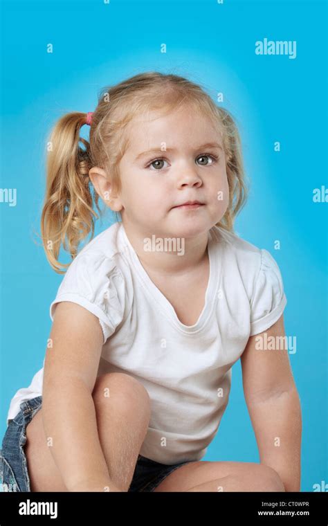 Cute Little Girl Sitting On Floor Stock Photo Alamy