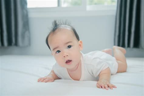 Premium Photo Asian Baby Lying On Bed With Soft Blanket Indoors Cute