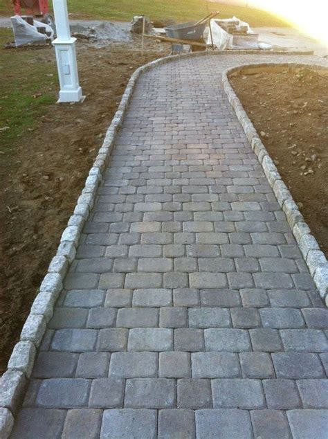 Plan To Install Paver Stones Natural Concrete Color On Edge Of Red