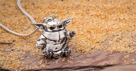 This Baby Yoda Necklace Will Reach Right Into Your Heart Gizmodo