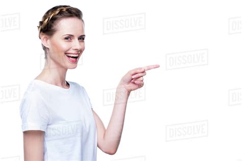 Beautiful Smiling Woman In White T Shirt Pointing Somewhere Isolated