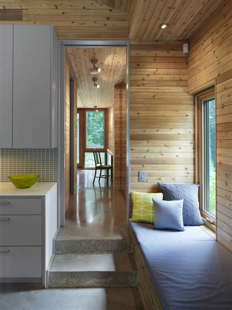 The layout of this tiny house is quite standard, but the contemporary interior really stands out. Ultra-Modern Cabin Blends Rustic Warmth With Modern Minimalism