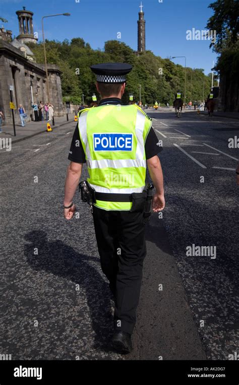 Police Officer Walking Stock Photo Alamy