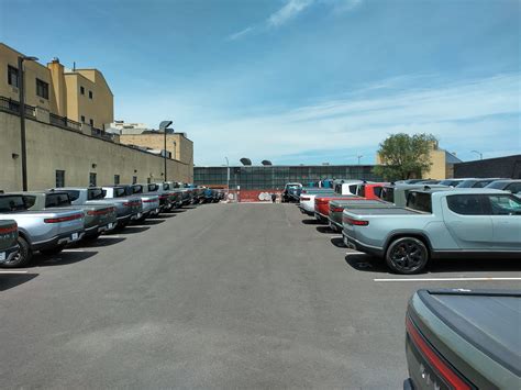 Current look at Brooklyn Rivian Service Center's parking lot full of