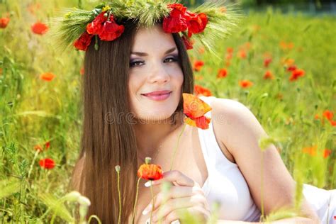 portrait of an attractive beautiful girl in a poppy field stock image image of people field