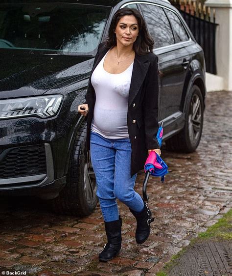 Casey Batchelor Displays Her Growing Bump In A Tight White Vest As She
