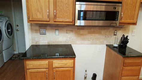 We kept the honey oak cabinets (hubby's decision, of course), and put in ubatuba granite, darkened the hardware, and took down a wall to make a peninsula between kit and dining. Uba Tuba Granite Countertops - Traditional - Kitchen - charlotte - by Fireplace & Granite ...