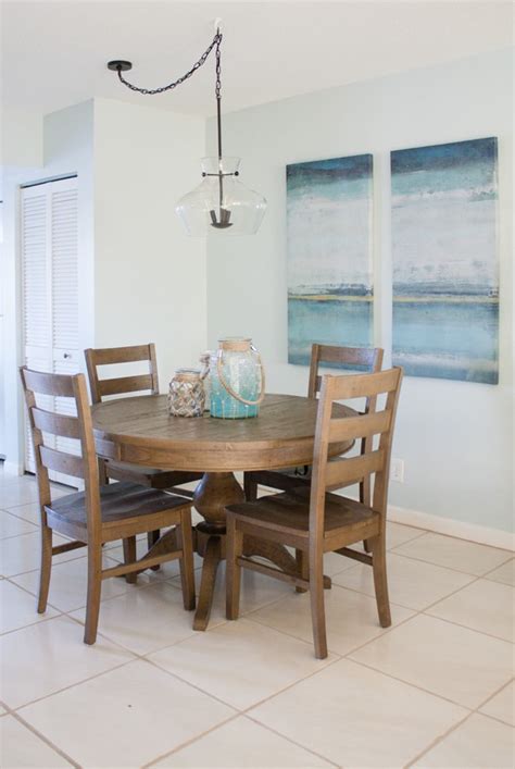 Introduce modern style to your casual dining nook or entertainment area with the warm and elegant feel of this dining set with a faux marble top. Coastal Dining Room Decor - The Lilypad Cottage