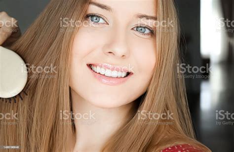 Beautiful Happy Woman Combing Her Long Hair Stock Photo Download