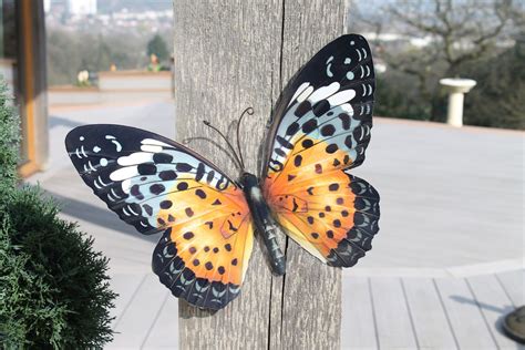 Mirrors with handcrafted metallic frames make the most sought for metal wall home décor in india. Large Metal Butterfly Wall Art in Orange and Black | Butterfly wall art, Metal butterfly wall ...