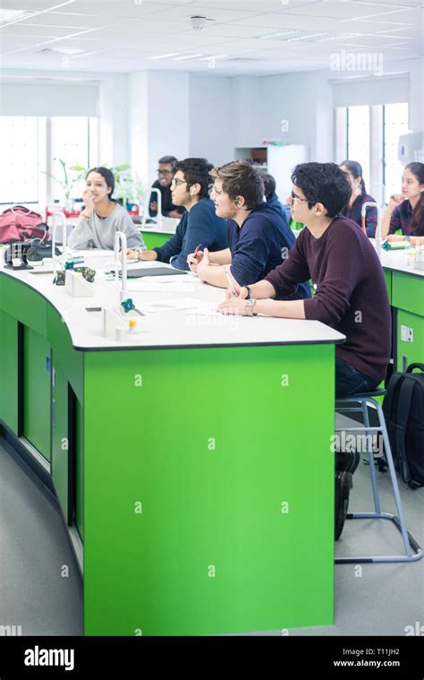 A Classroom Full Of International Students During A Science Lesson