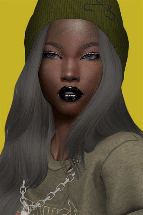 A Woman With Long Hair And Black Lipstick Wearing A Green Beanie On Top