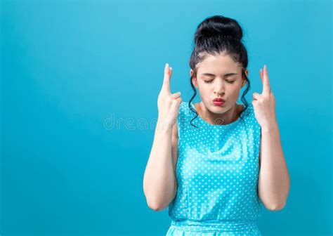 Young Woman Wishing For Good Luck Stock Photo Image Of Woman