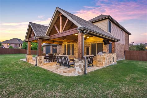 Double Gable Patio Cover With Outdoor Kitchen And Flagstone Flooring Patio Design Backyard