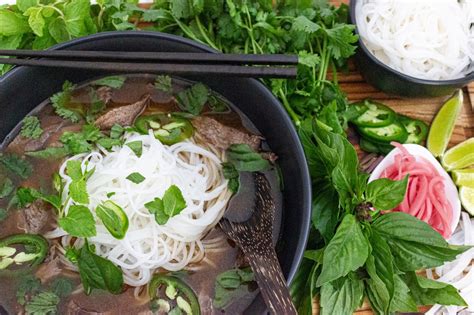Hearty And Authentic Vietnamese Beef Pho With Flank Steak Cakes And Coriander