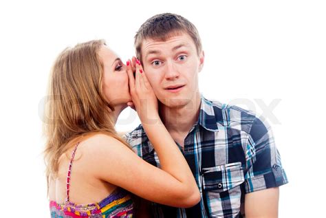 Girl Whispers To The Guy In The Ear Stock Image Colourbox