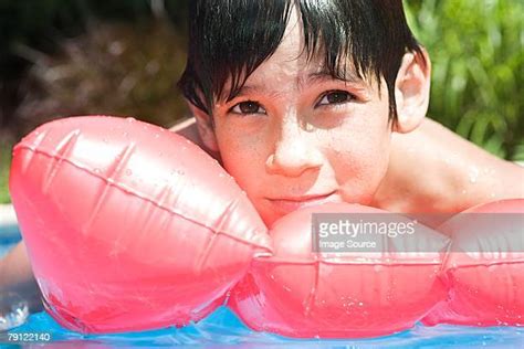 Boy In Airbed Pool Photos And Premium High Res Pictures Getty Images