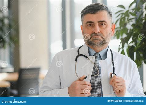Portrait Of A Senior Doctor In His Office In A Hospital Stock Image