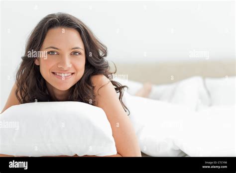 Attractive Woman Hugging A Pillow Stock Photo Alamy