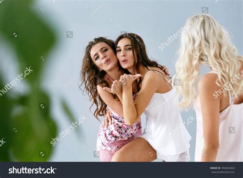 Sexy Women Blowing Kisses Enjoying Home Shutterstock