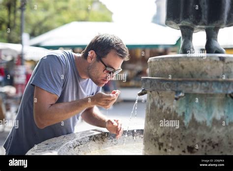 Man Drinking From Fountain High Resolution Stock Photography And Images