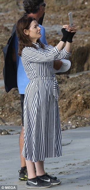 nigella lawson covers up in long sleeved dress on auckland beach daily mail online