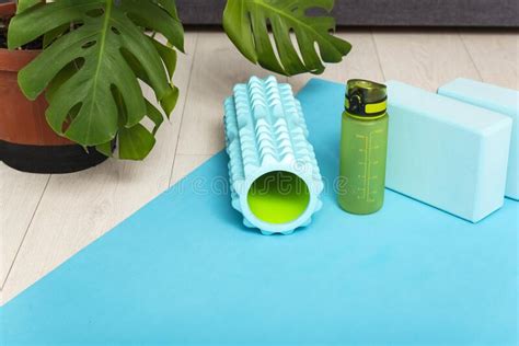 Foam Roller For Massage Of Muscle And Fascia Gym Blocks And A Bottle Of Water In Home Interior