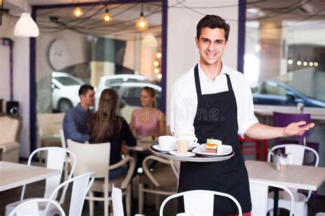 Waiter Is Warmly Welcoming Guests Stock Photo Image Of Adult