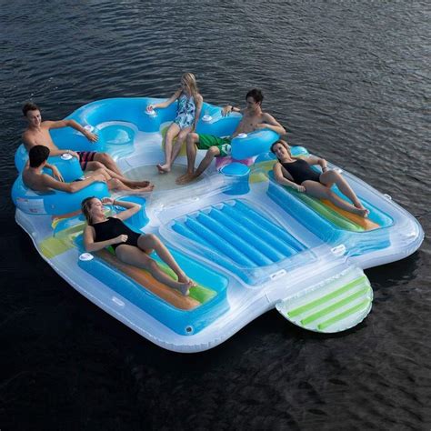 Several People Are Floating On An Inflatable Raft