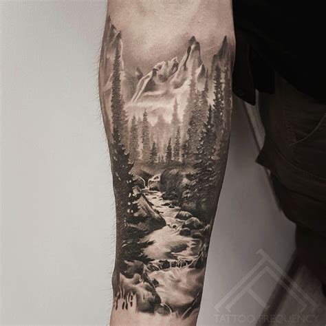 Completely Healed Black And Gray Landscape Tattoo On Mans Arm Artist