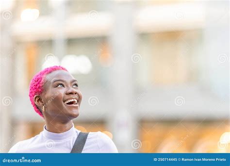 Beauty African Woman Looking Up To The Sky While Smiling Stock Image
