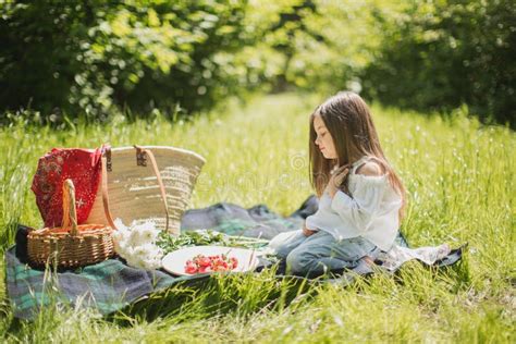 Little Girl On A Summer Picnic In Nature With Berries Stock Image