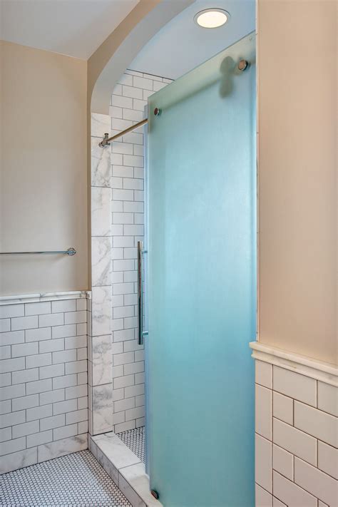 A Frosted Glass Barn Door For The Shower Adds A Modern Touch To A Traditional Home