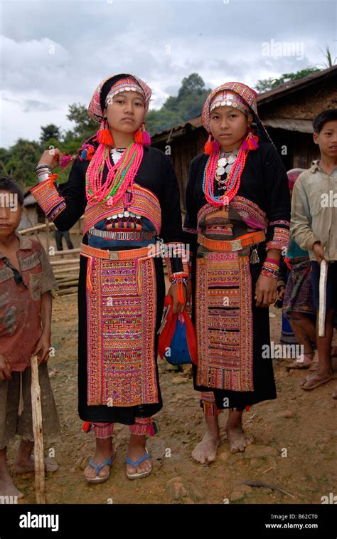 Young Women Of The Akha Pala Tribe Wearing Traditional Colourful