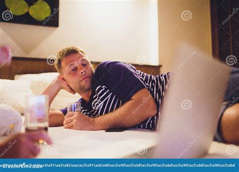 Tired Man Lying On Bed At Home And Working With Laptop Late At Night Stock Image Image Of