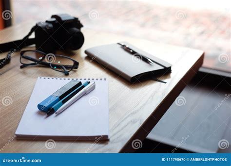 Camera Coffee Diary And Pens On A Wooden Table Stock Photo Image Of