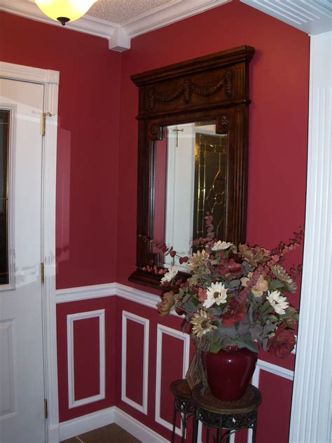 Its usually decotated in different chapes and cuts. Foyer: chair rail, wall frames, and crown molding with ...