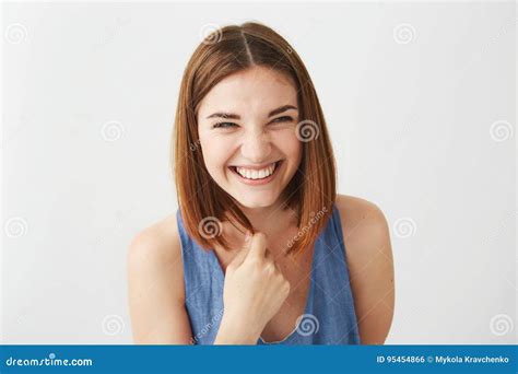 Portrait Of Cheerful Happy Young Beautiful Girl Laughing Smiling Over