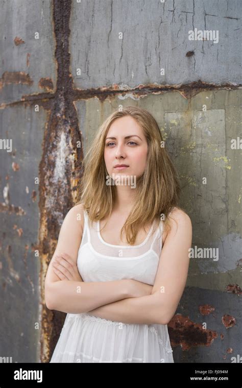 Serious Young Woman Arms Folded Outdoors Looking Away Stock Photo Alamy