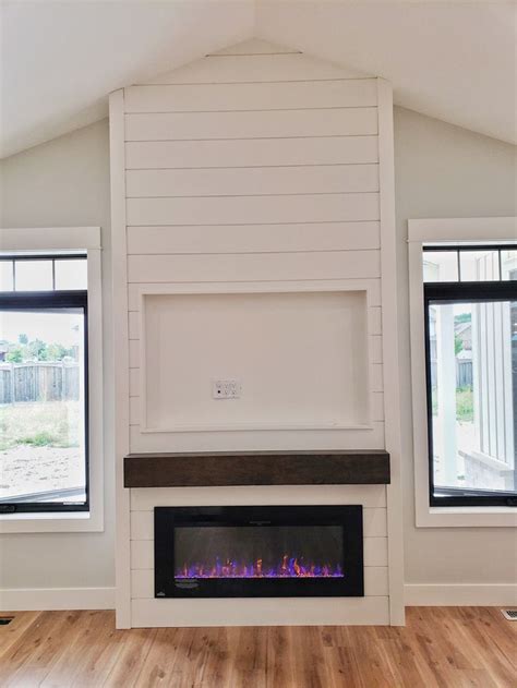 Clean White Shiplap Linear Fireplace Detail With Tv Shadow Box