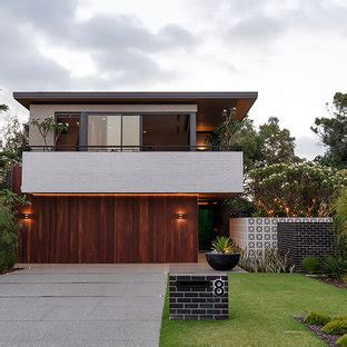 But with their accent on sculpted interior spaces and seamless connections between indoor and. 75 Beautiful Mid-Century Modern Two-Story Exterior Home ...
