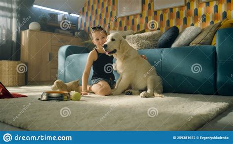 Young Girl Feeding Dog Stock Photo Image Of Floor Cozy 259381652