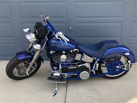 Its kerb weight will get you thinking a whole day as to how to handle the beast. 1999 Harley-Davidson® FLSTF Fat Boy® (Blue), Firestone ...