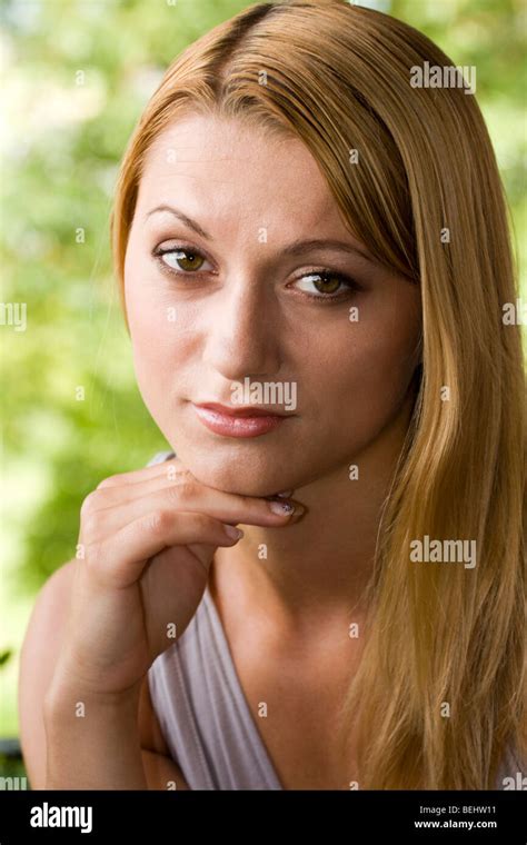 Beautiful Young Woman Posing With Hand Under Her Chin Stock Photo Alamy