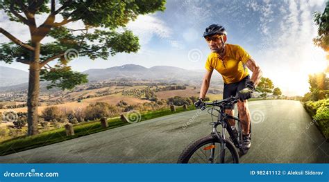 Bicycle Rider Cycle In Village Hills Nature Landscape Road In Motion